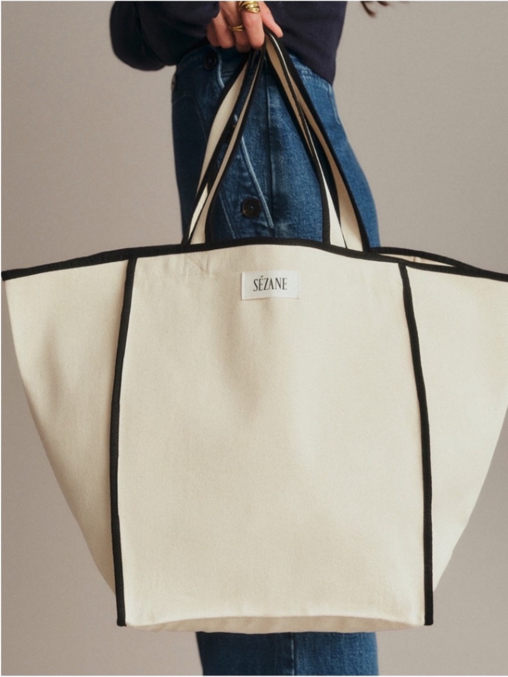 SÉZANE Cream Cotton Tote With Black Piping Border.
